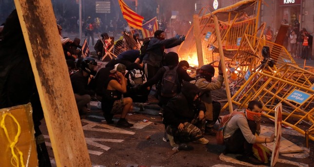 At least 200 injured in police clashes with protesters in Spain
