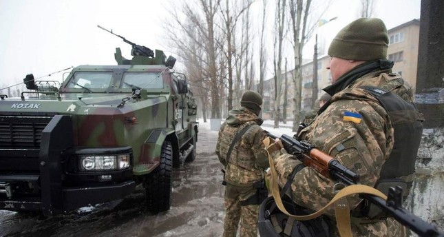 More troop withdrawals in Ukraine's east ahead of talks