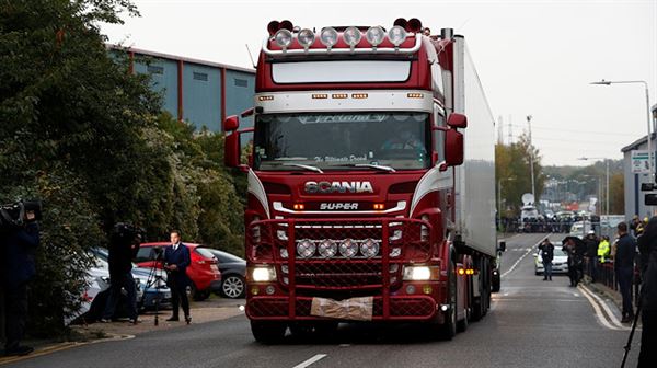 UK police investigating 39 lorry deaths raid two addresses