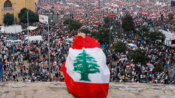 Lebanon set to cut ministers' pay as protests engulf country