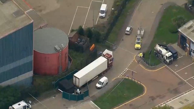 Driver arrested after 39 bodies found in truck container near London