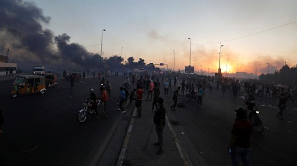 Iraq seeks arrest of 2 policemen over protester deaths