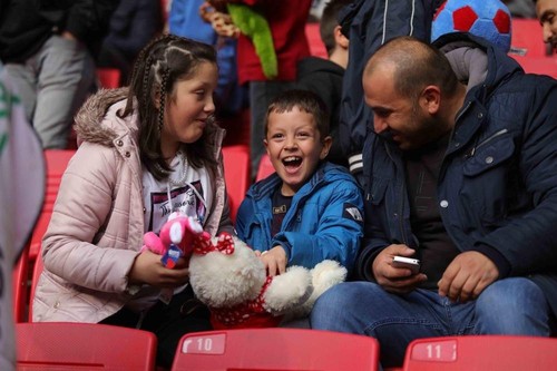 Turkish football fans shower orphans with toys during match