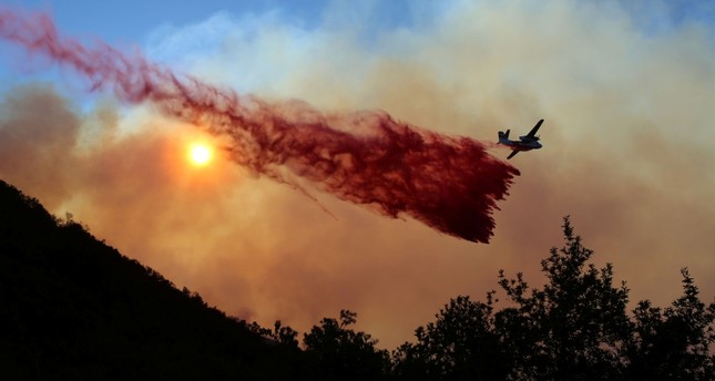 Thousands told to evacuate as wildfires spread in California