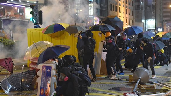 China raises criticism as Hong Kong chief urges calm