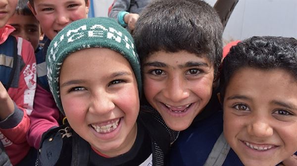 Turkish aid body puts smile on kids' faces in Syria on World…
