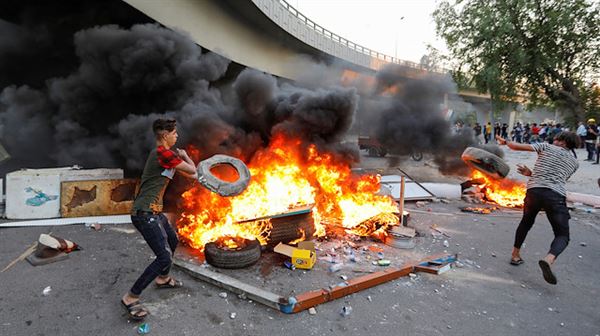 Protestors in Iraq set fire to homes of three lawmakers