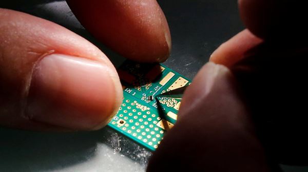 China's top chip maker urges US firms to help ease tensions