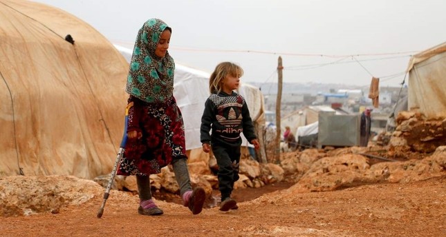 Syrian girl walks to school after receiving prosthetic legs in Turkey